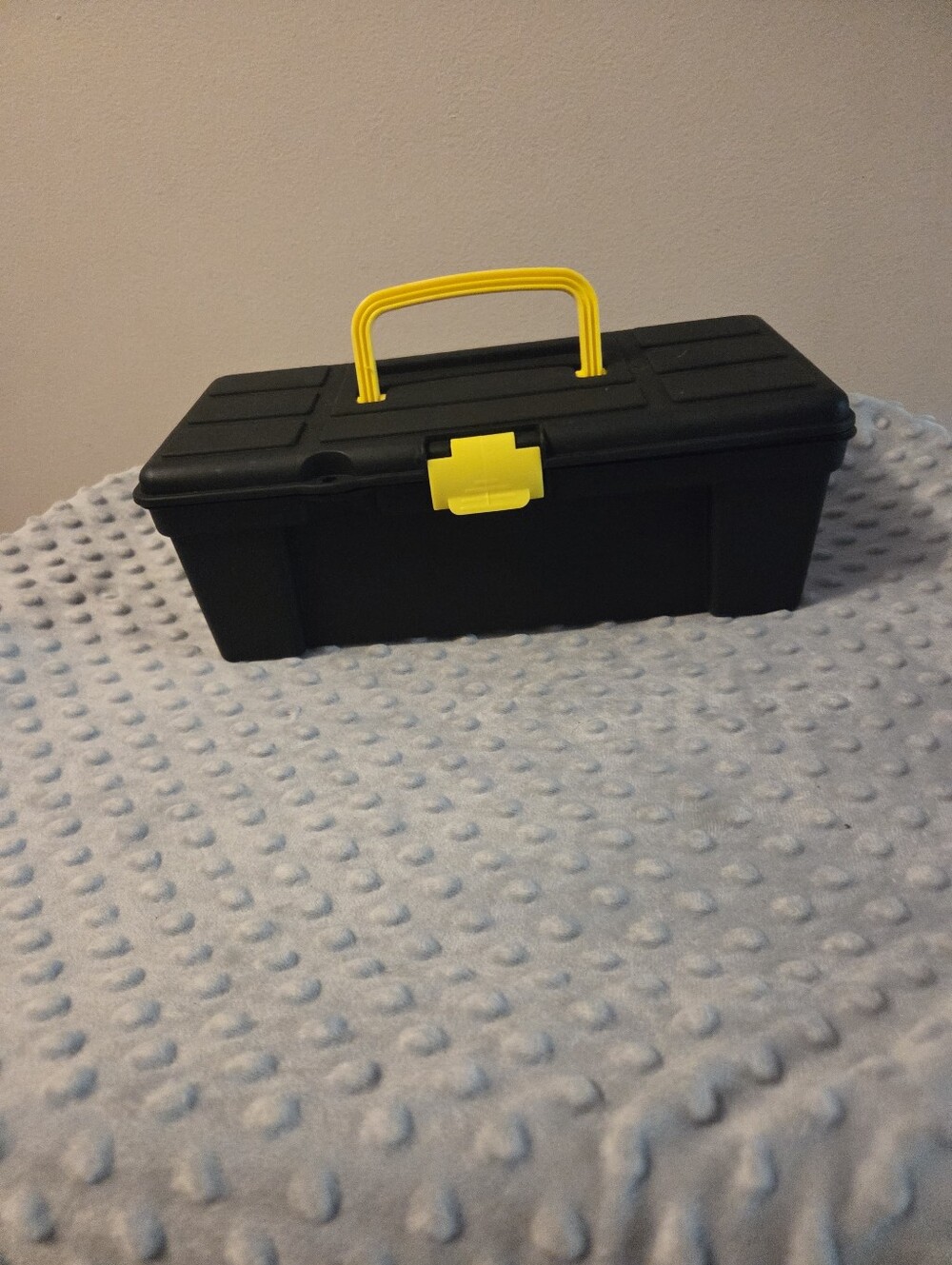 Small black and yellow kids tackle or tool box
